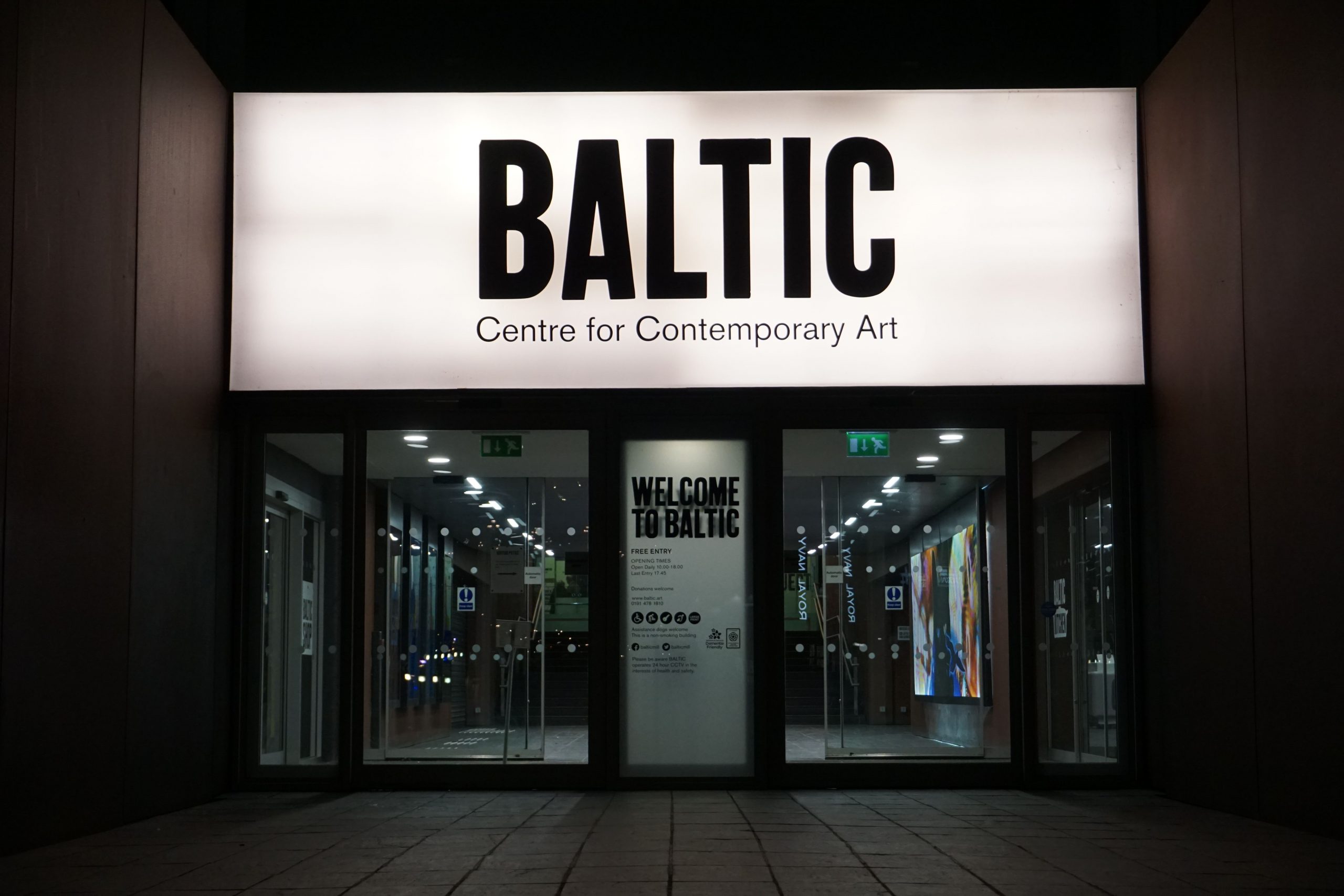 Baltic Art Center in Newcastle at night, neon light sign dominates the scene